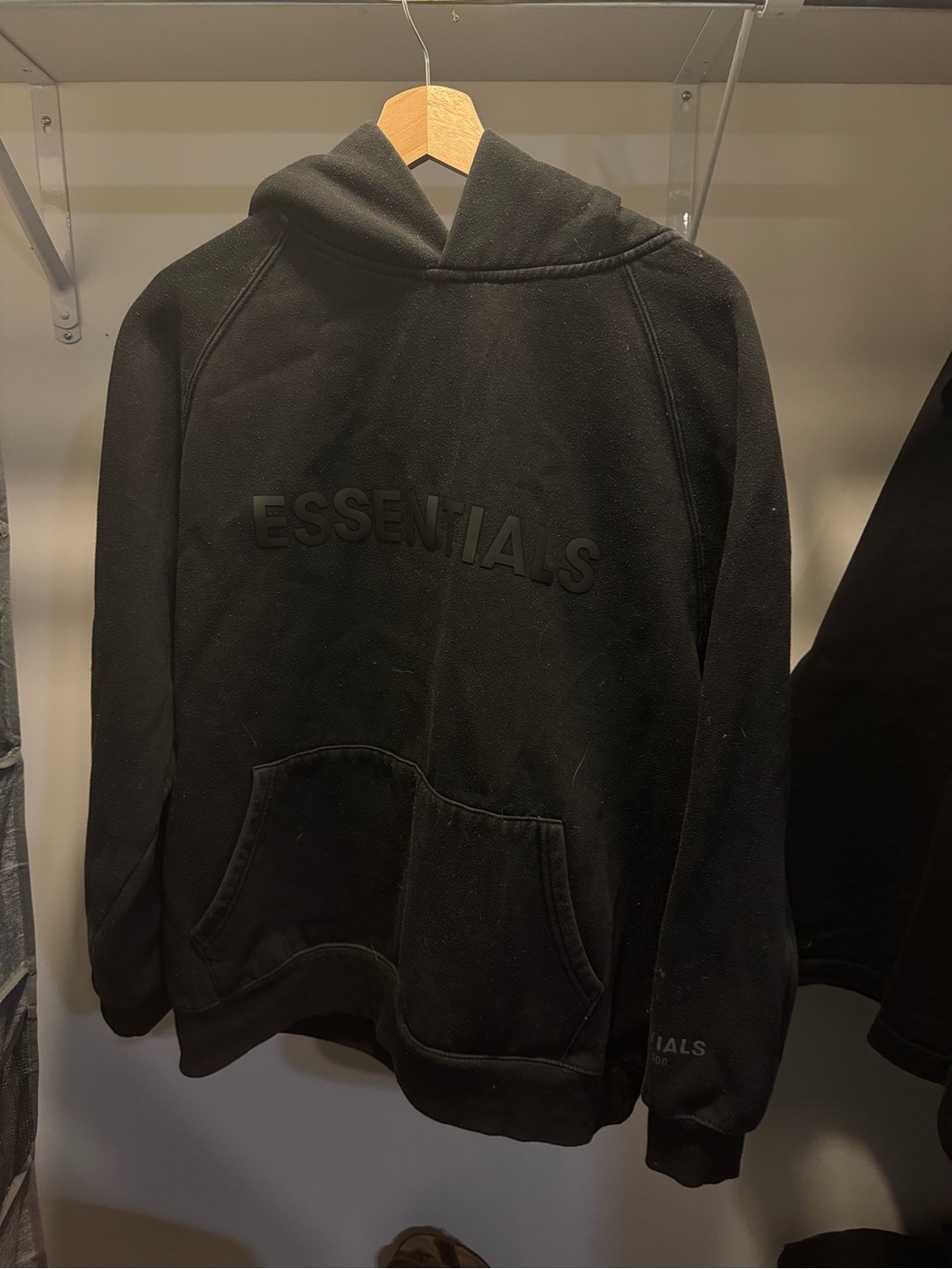 Essentials Black Pullover Hoodie with Raised Logo